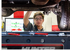 Student working on car