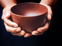 hands holding empty bowl