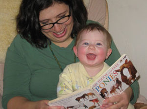 woman reading with toddler