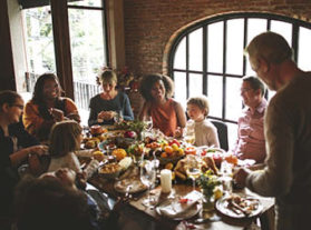 Family and friends join together for Thanksgiving meal