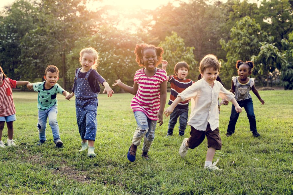 Group of Kids Playing at the Field Together