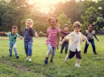 Group of Kids Playing at the Field Together