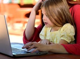 kid, mom at computer
