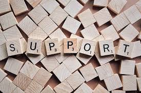 scrabble letters spelling "support"