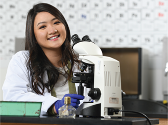 Jolaya Lee at her microscope