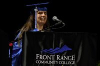 Maddie speaking at the graduation podium