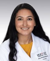 Brissa headshot in white doctor's coat