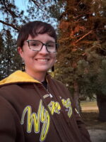 Head and shoulders shot of Leah in a brown sweatshirt