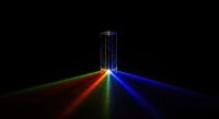 A clear rectangular prism with colorful lights emerging from it.